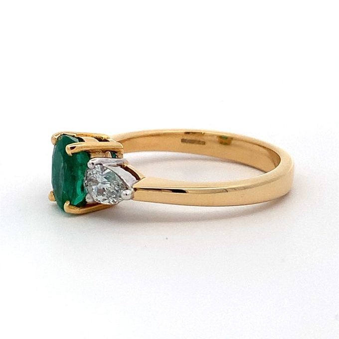 Emerald and Pear Cut Diamond Three Stone Ring