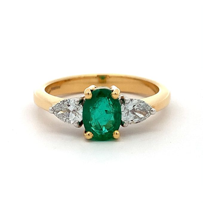 Emerald and Pear Cut Diamond Three Stone Ring
